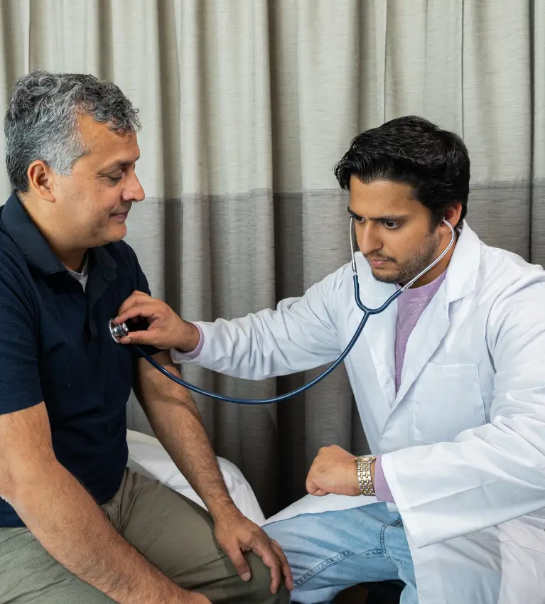 Homeopathic doctor evaluating coughing, wheezing, and breathlessness patterns during a clinical assessment at Dr. L Square Multispecialty Homeopathy Clinic