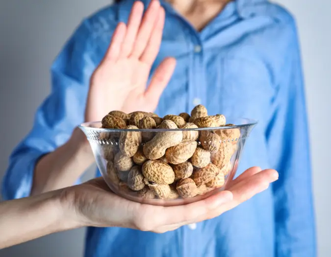 Patient consulting doctor for peanut, tree nut, and seed allergy symptoms at Dr. L Square Multispecialty Homeopathy Clinic