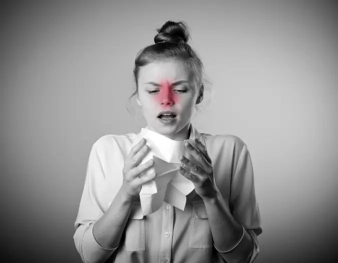 Person dealing with a persistent runny nose from airborne allergens receiving care at Dr. L Square Multispecialty Homeopathy Clinic