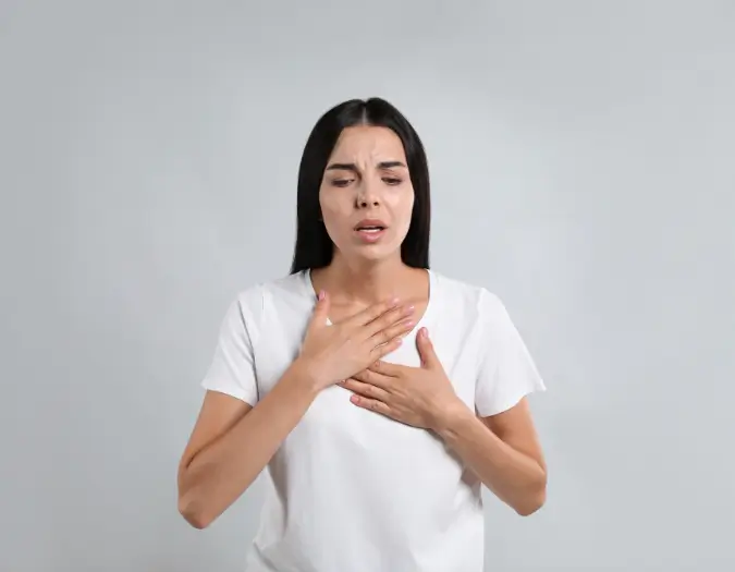 Patient experiencing difficulty breathing due to respiratory allergy triggers at Dr. L Square Multispecialty Homeopathy Clinic